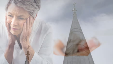 worried elderly woman over church steeple and praying hands