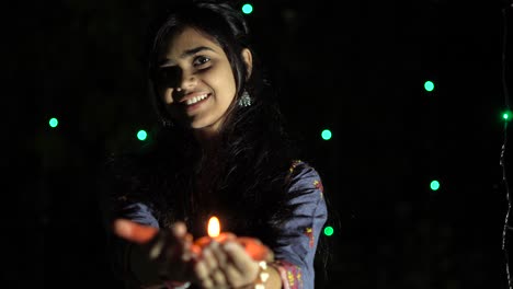 indian girl with diwali diya