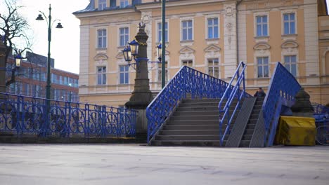 man does a kickflip down big stair set