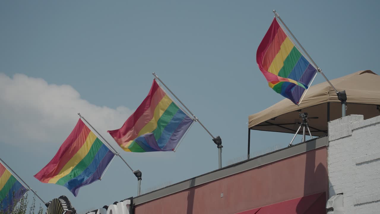 Rainbow Pride Flags on Building Rooftop