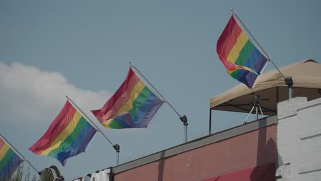 rainbow pride flags on building rooftop
