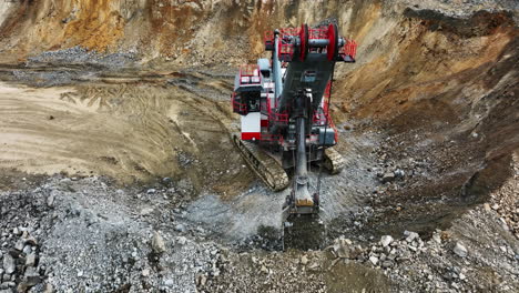 large excavator operating in an open pit mine