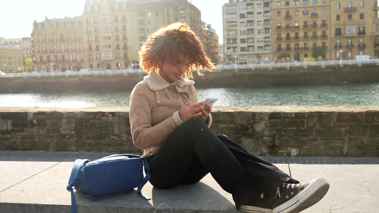 Woman using smartphone in an urban setting