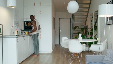 man preparing breakfast in a modern kitchen