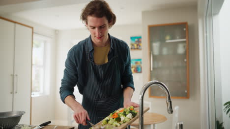 man preparing vegetables in the kitchen