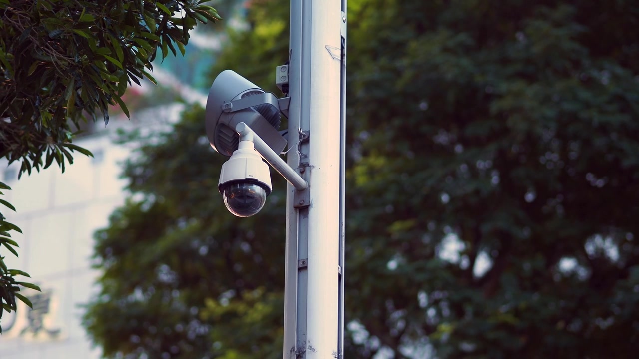 Security Camera Mounted on a Pole in an Urban Setting