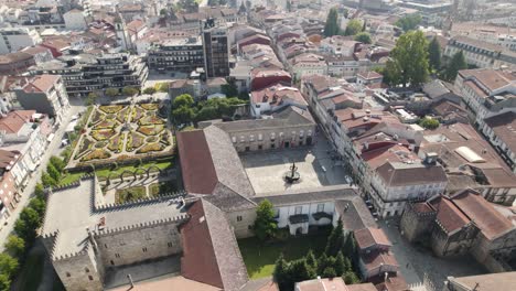 Aerial-panoramic-orbiting-view-of-Santa-Barbara-municipal-garden-on-civil-parish-of-Sè,-Braga