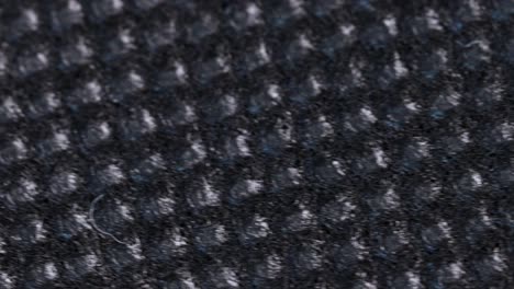 black absorbent cloth, macro shot close up view with fast rotation motion