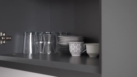 kitchen cupboard with dishes and glasses