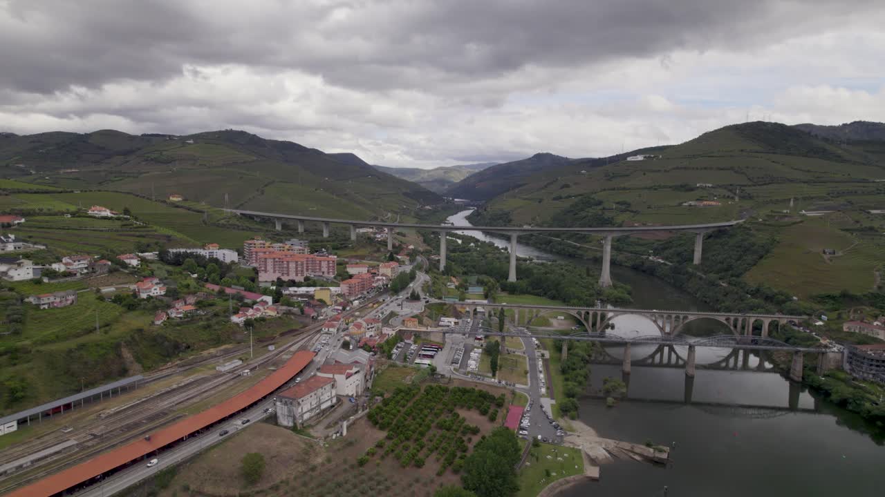 Aerial - Peso da Régua with multiple bridges crossing Douro River in Portugal’s Alto Douro Vinhateiro, Vila Real