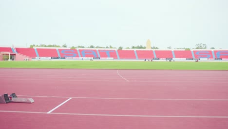 para-athlete preparing for sprint race at stadium