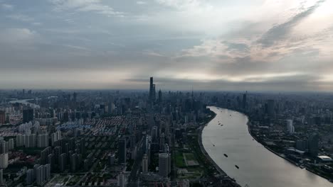 drone aerial view of buildings, cityscape and river in downtown