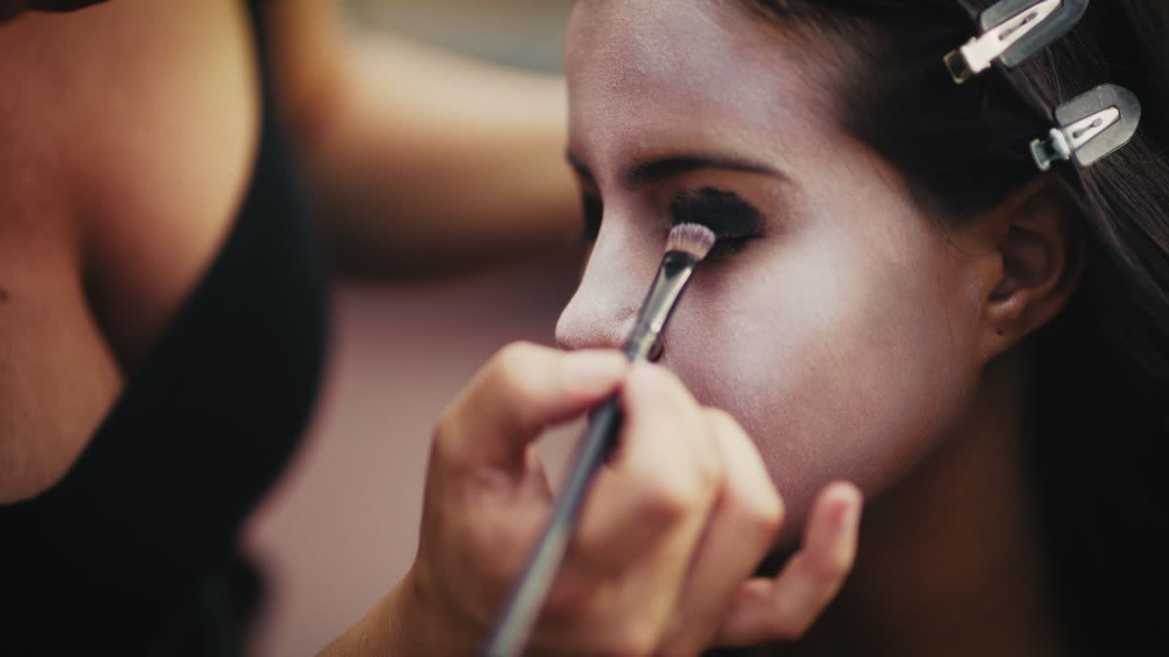 Makeup Artist Applying Face Paint