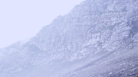 Time-lapse-of-mist-rolling-across-rocky-terrain