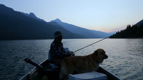 fisherman fishing with his dog in the river 4k