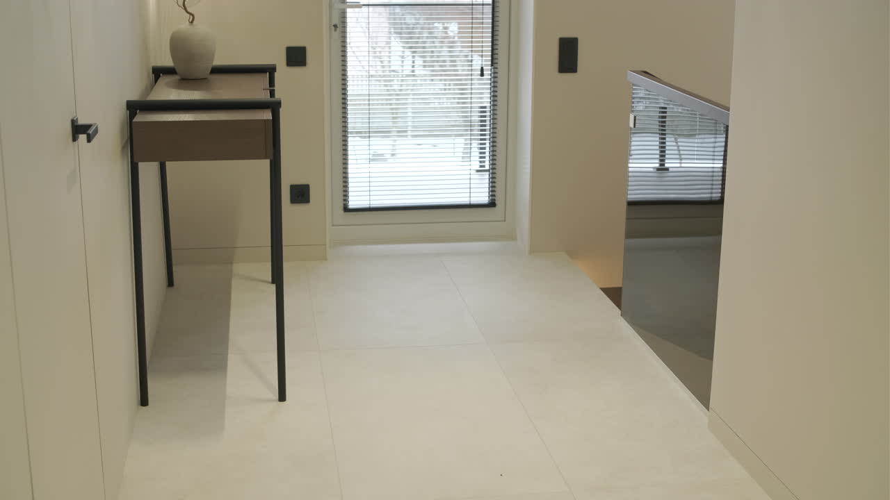 Modern Home Hallway with Window, Blinds, and Staircase