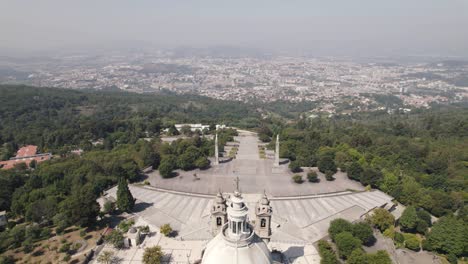 Aerial-pullback-of-the-Sanctuary-of-Sameiro-against-Braga-sprawling-cityscape