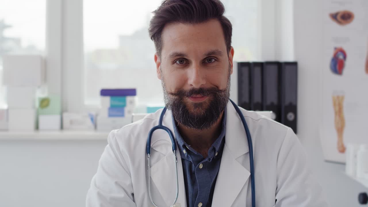 Handheld video shows of smiling doctor in doctor&rsquo;s office