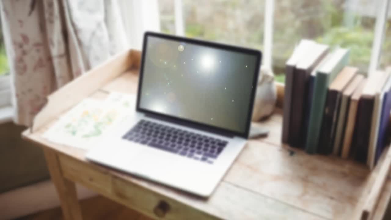 노트북 위의 빛 점의 애니메이션