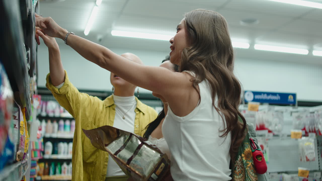 Friends shopping in a supermarket aisle