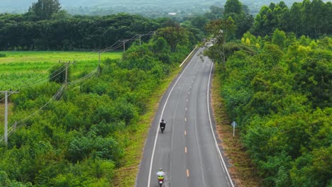 country road with motorcyclist