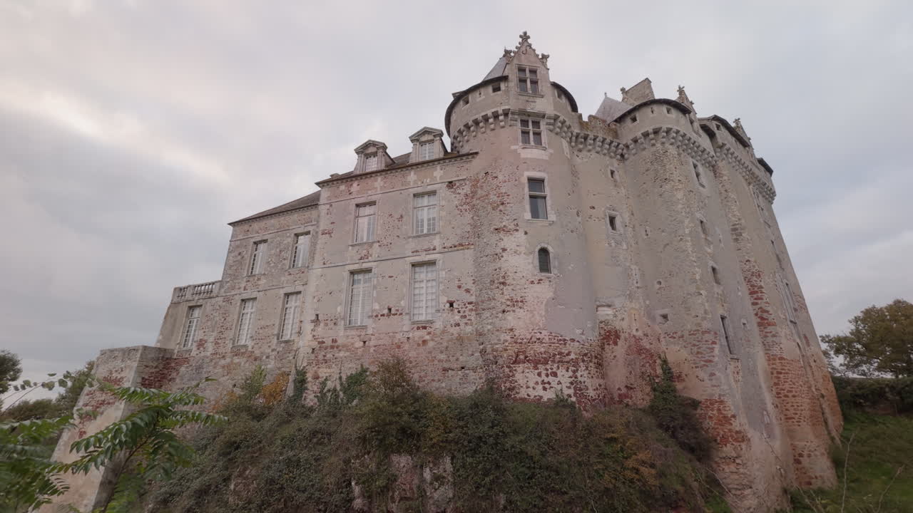 Historic Château du Bouchet stands tall in Rosnay France surrounded by the ponds of La Brenne