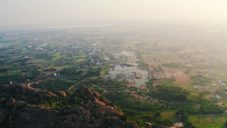 aerial view of indian rural landscape with mountains and village