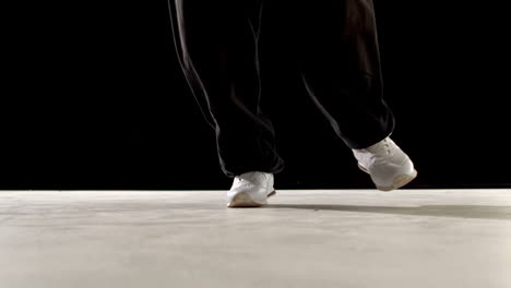 Cool-young-break-dancer-dancing-on-black-background