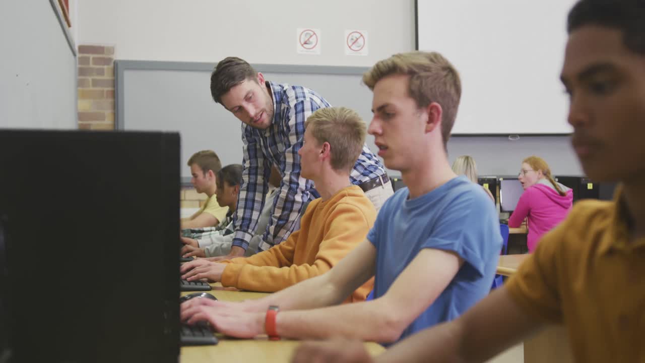 Students working on computers in high school class