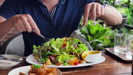 person eating a salad