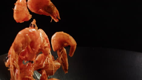 cooking shrimp in a wok