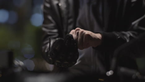 motorcycle rider wearing and testing his gloves