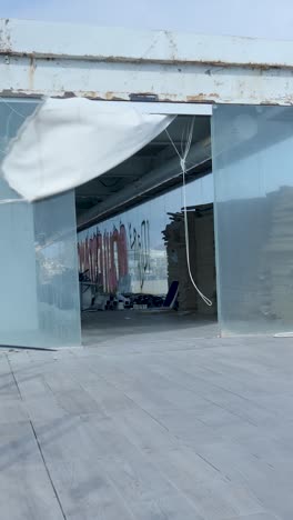 modern building exterior with white cloth draped by wind