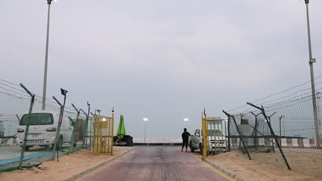 static shot of a guard at the barriers into the drift track in dubai