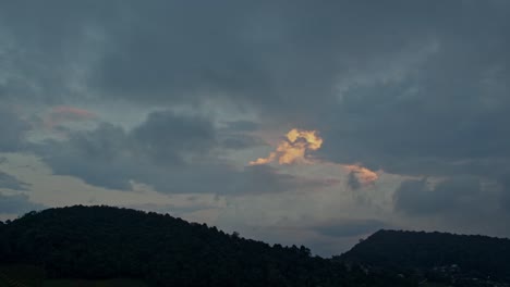 dramatic clouds over mountains at sunrise/sunset