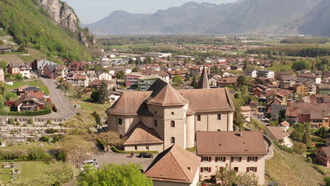 Aerial-of-beautiful-old-church-in-small-Swiss-town