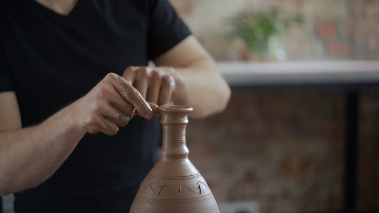 Pottery Artist Shaping a Clay Vessel