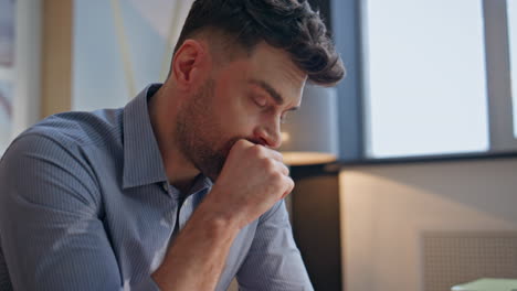 businessman hands making notes at notebook indoors closeup. tired man pondering