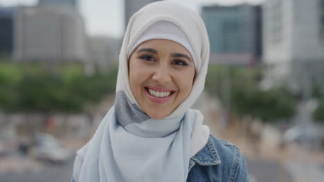 portrait young happy muslim woman laughing enjoying successful urban lifestyle independent female student wearing hijab headscarf in city real people series