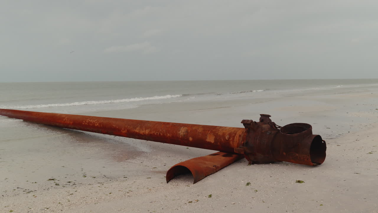Rusty Pipeline on a Beach