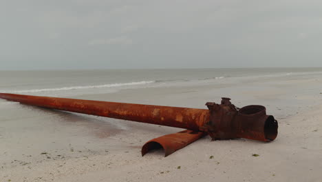 rusty pipeline on a beach