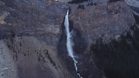 Waterfall-in-the-mountains-approached-tilt-to-creek