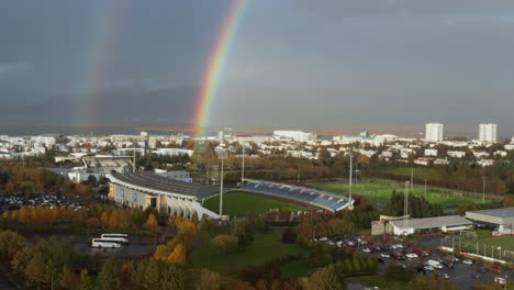 colorful rainbow in reykjavik at national football stadium, aerial