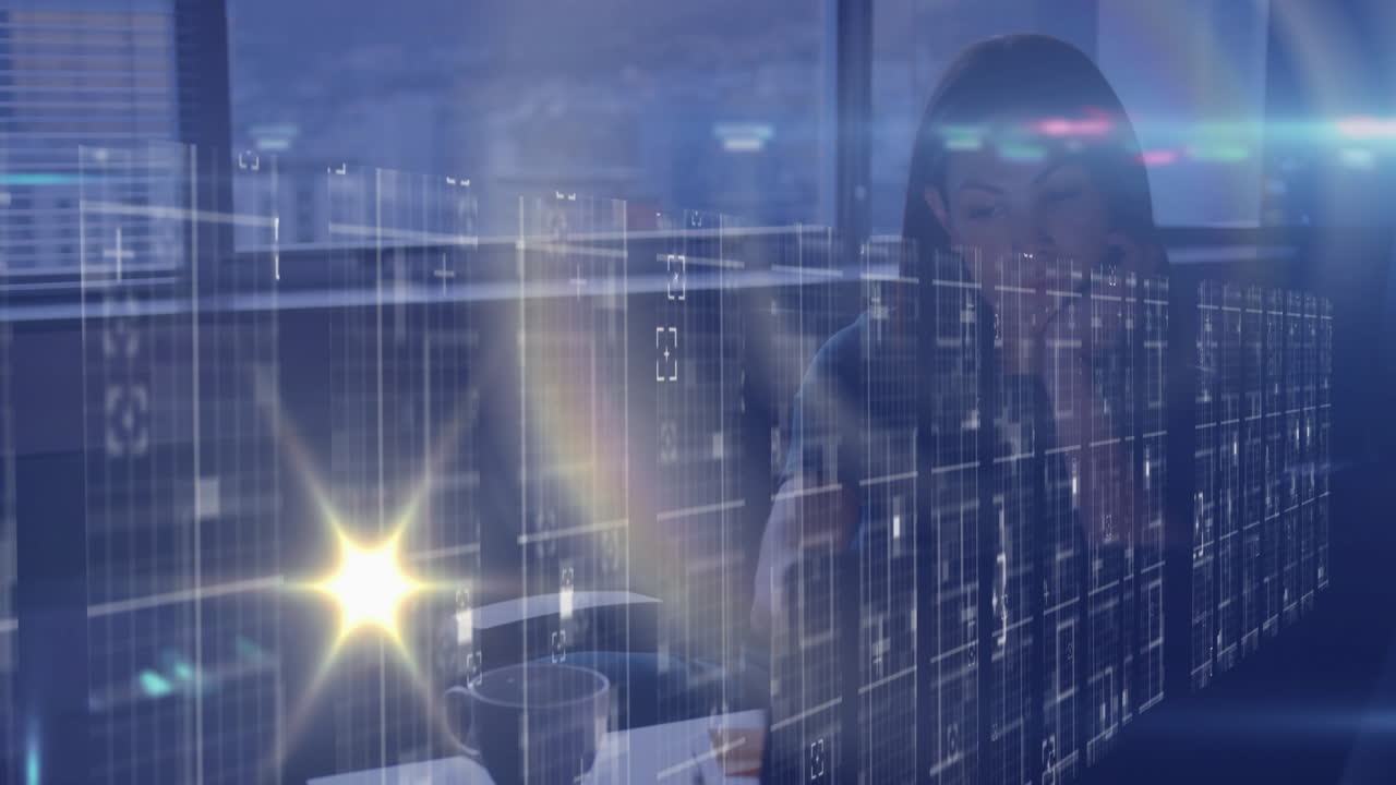 Businesswoman working at desk with digital data processing animation overlay