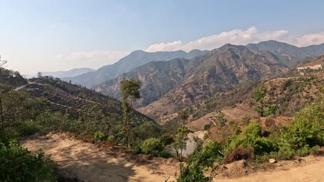 View-over-vast-high-valleys-with-terraced-fields-in-the-foothills-of-the-Himalayas,-Helambu-Region,-Nepal