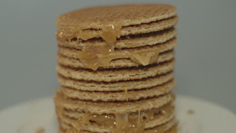 tilt up over delicious stack of stroopwafels, a typical dutch cookie