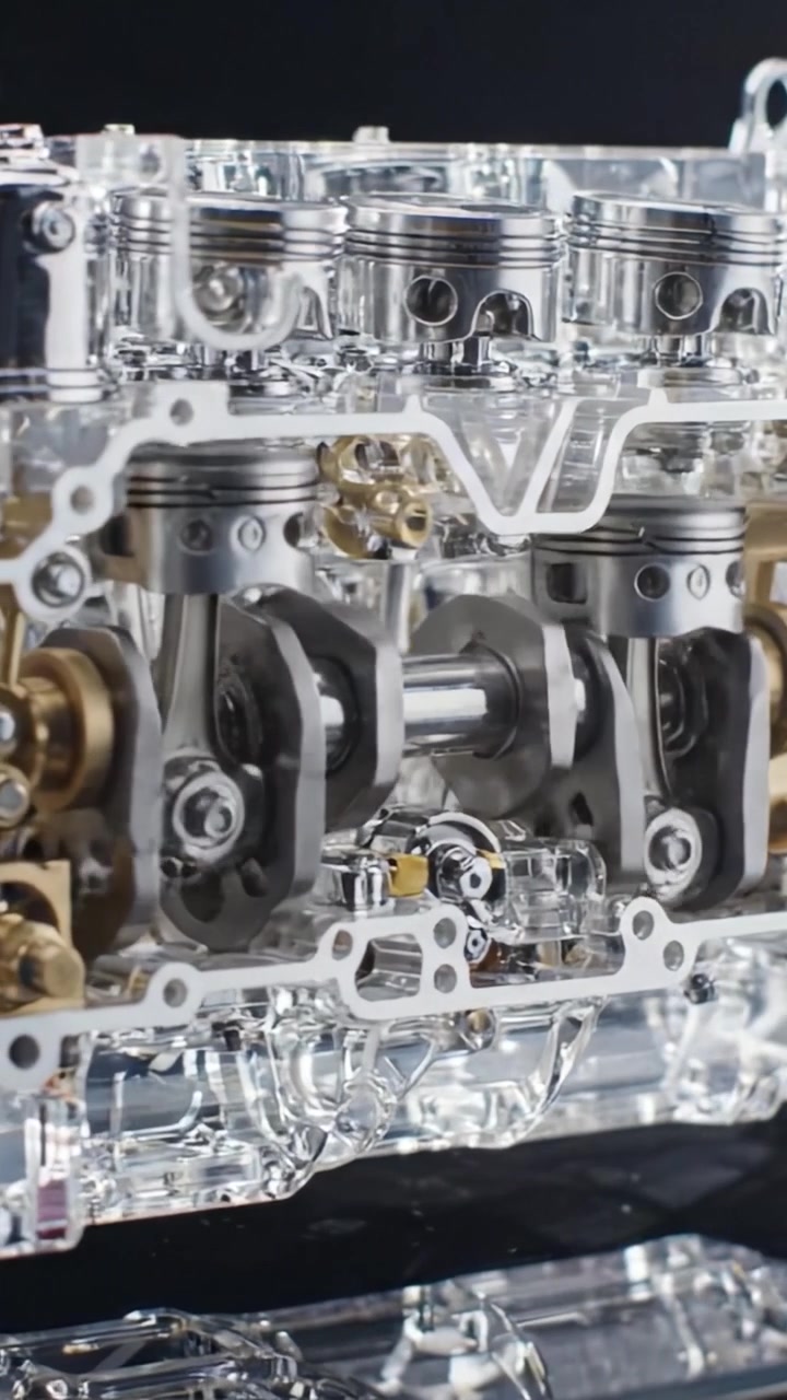 Detailed Close-Up of a Transparent Engine Block Showcasing Pistons and Crankshaft Mechanics, Ideal for Understanding Internal Combustion Engine Components
