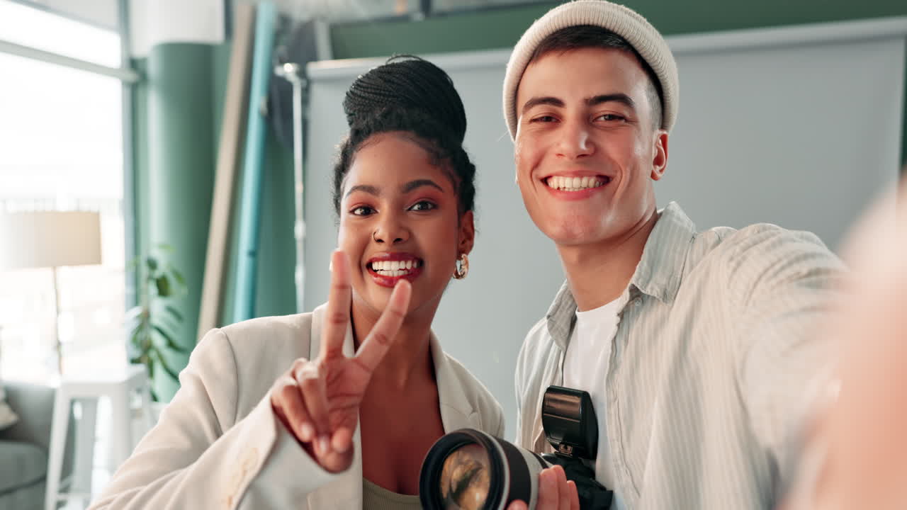 Photographer and model taking selfie in studio