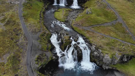 drone of waterfall near kirkjufell in national park in iceland