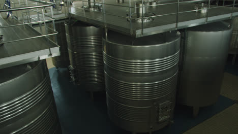 Amazing-shot-inside-a-wine-factory-inside-large-gray-metal-containers-in-Burgos,-Spain